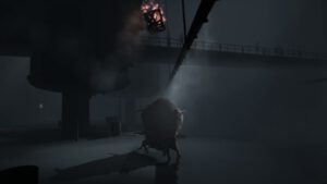 Een screenshot uit Inside. De Huddle gooit een brandende kist over wat sproeiers heen.