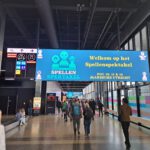 Digitale borden met het logo van het Spellenspektakel in de Jaarbeurshal, Utrecht