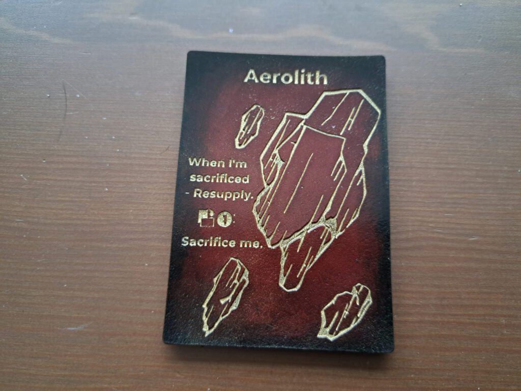 Mijn Aerolith token, gewonnen op de set 4 Tumult Championship in Halte 13