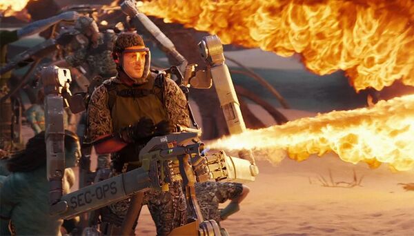 Een soldaat in exoskelet met een vlammenwerper. Een screenshot uit AVATAR: The Way of Water.