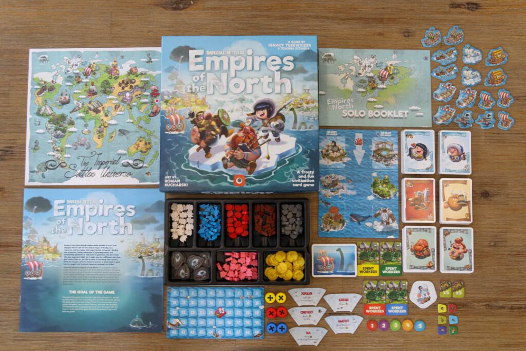 De onderdelen van Imperial Settlers: Empires of the North, netjes uitgestald rondom de doos.