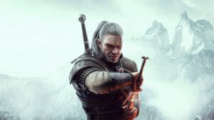 Key art voor Witcher 3. Geralt staat met zwaard in hand voor een grijze achtergrond.