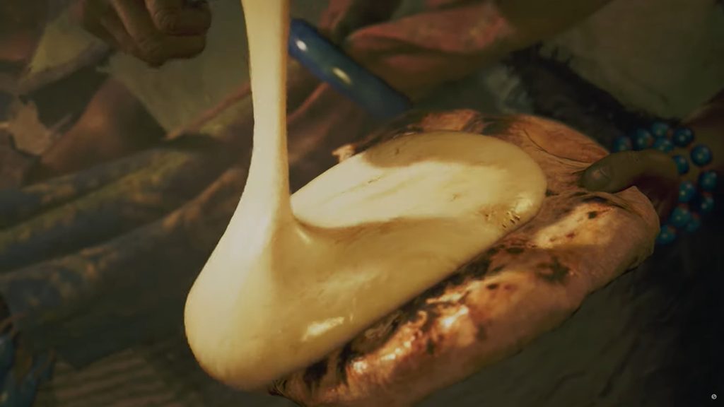 Heerlijke gesmolten kaas op brood recht uit de oven. Een screenshot uit Monster Hunter Wilds.